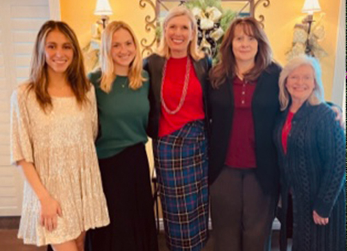 Maisie with coworkers at an event